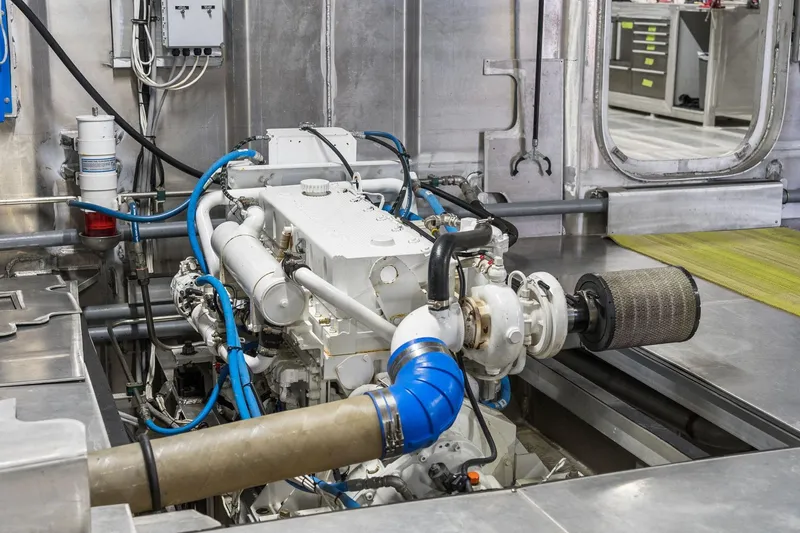 Shine Down Yacht Photos Pics Engine room of 2025 Breaux Brothers 120 GLV vessel, showcasing machinery and components.