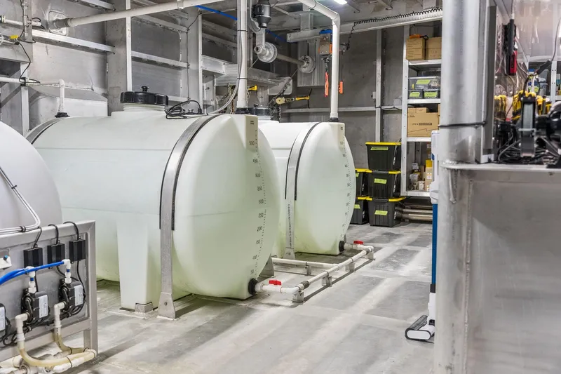 Shine Down Yacht Photos Pics Industrial storage tanks in a facility, featuring Breaux Brothers 120 GLV, 2025 model.