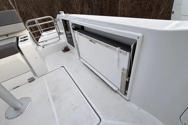  Yacht Photos Pics 2022 Jeanneau Leader 9.0 CC boat interior with seating and storage compartment.