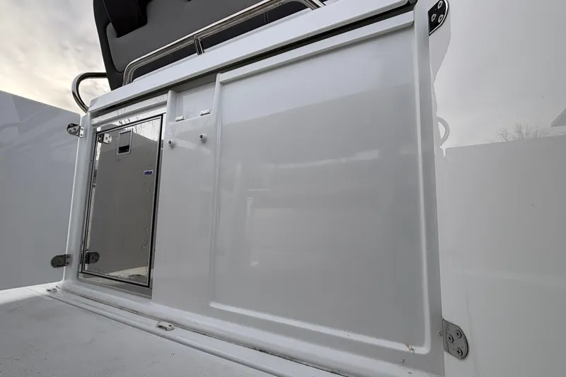  Yacht Photos Pics 2022 Jeanneau Leader 9.0 CC boat storage compartment with sleek white finish.