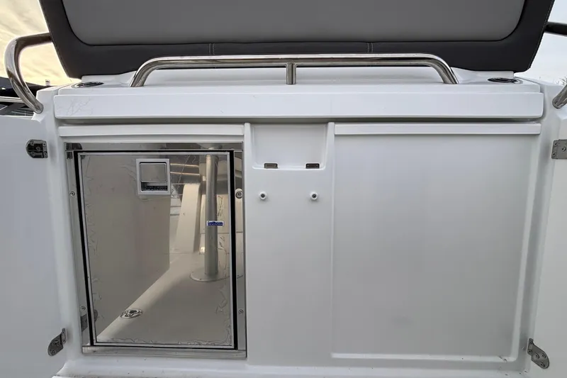  Yacht Photos Pics 2022 Jeanneau Leader 9.0 CC boat interior with stainless steel fixtures and storage compartment.