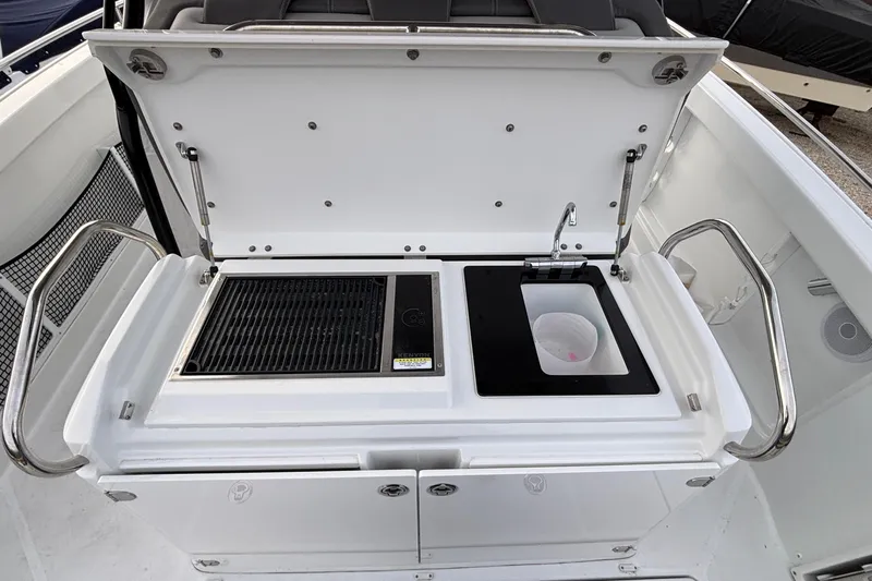  Yacht Photos Pics 2022 Jeanneau Leader 9.0 CC boat kitchen with grill and sink.