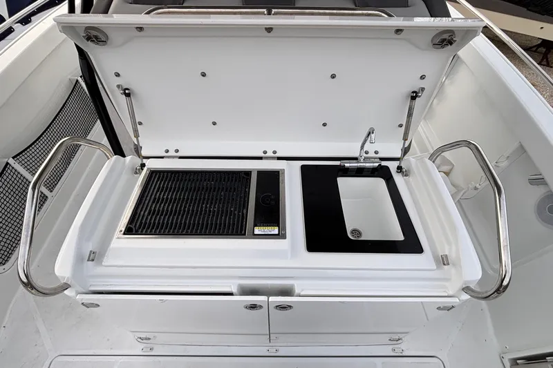  Yacht Photos Pics 2022 Jeanneau Leader 9.0 CC boat kitchenette with grill and sink.
