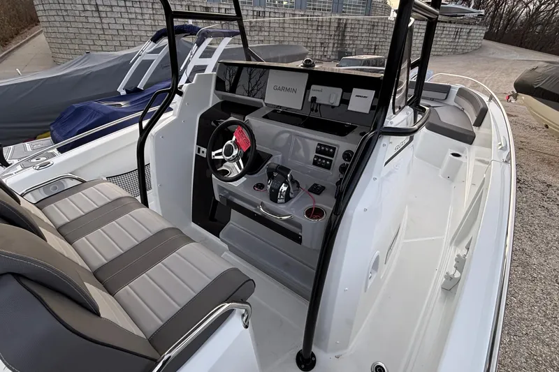  Yacht Photos Pics 2022 Jeanneau Leader 9.0 CC boat interior with modern helm and seating.