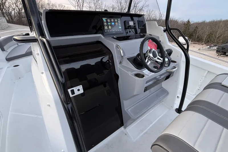  Yacht Photos Pics 2022 Jeanneau Leader 9.0 CC boat cockpit with modern steering and controls.
