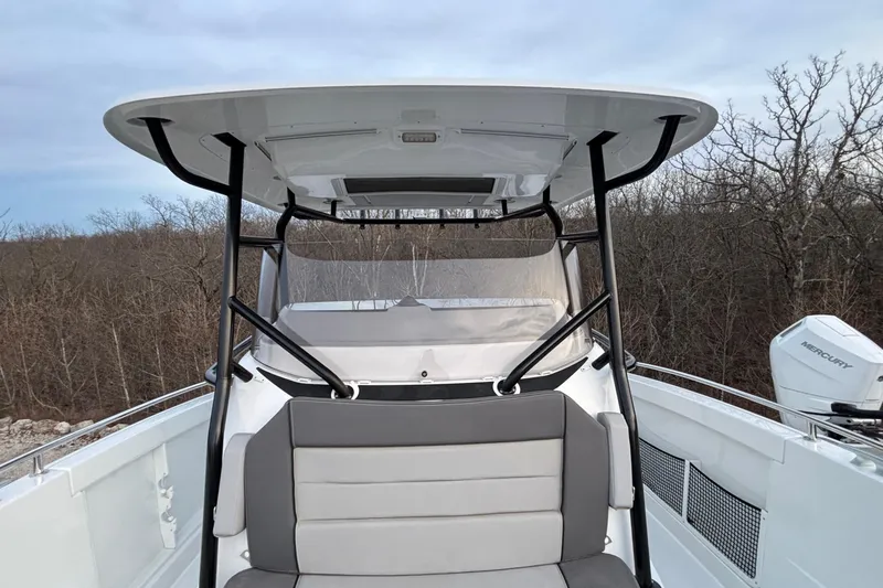  Yacht Photos Pics 2022 Jeanneau Leader 9.0 CC boat with seating and canopy, outdoors.