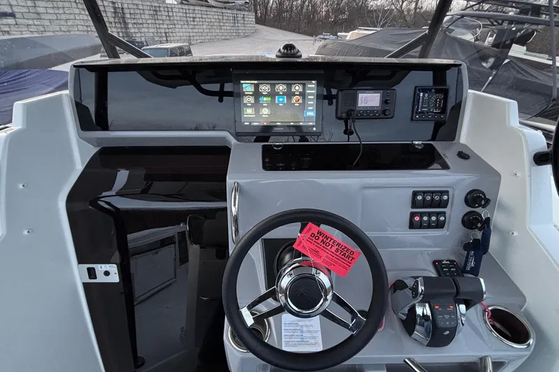  Yacht Photos Pics Cockpit of 2022 Jeanneau Leader 9.0 CC with modern controls and navigation display.