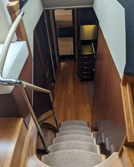  Yacht Photos Pics Interior view of 2008 Princess V65 yacht, featuring wooden stairs and modern design.
