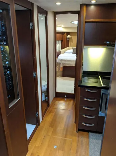  Yacht Photos Pics Luxurious interior of 2008 Princess V65 yacht with wood finishes and modern amenities.