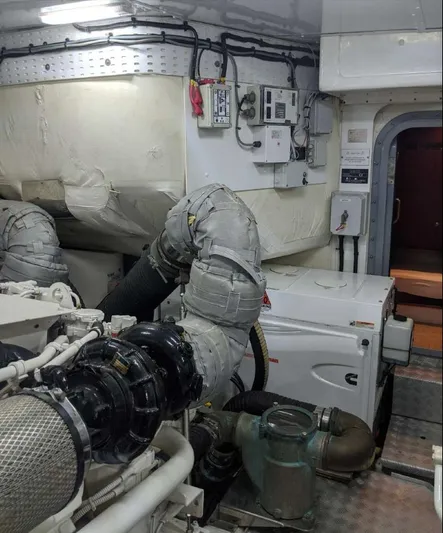  Yacht Photos Pics Engine room of a 2008 Princess V65 yacht, showcasing machinery and equipment.