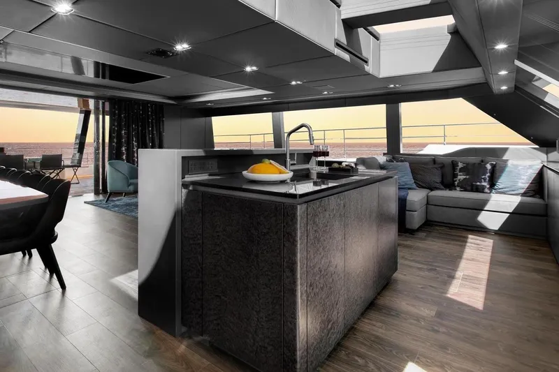  Yacht Photos Pics Luxurious interior of 2020 Sunreef 80 Power yacht with modern kitchen and ocean view.