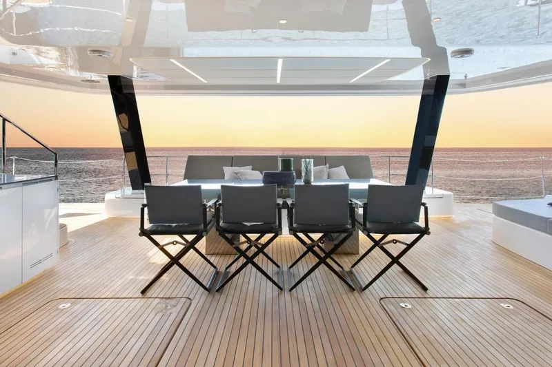  Yacht Photos Pics Luxurious Sunreef 80 Power yacht deck with ocean view at sunset, 2020 model.