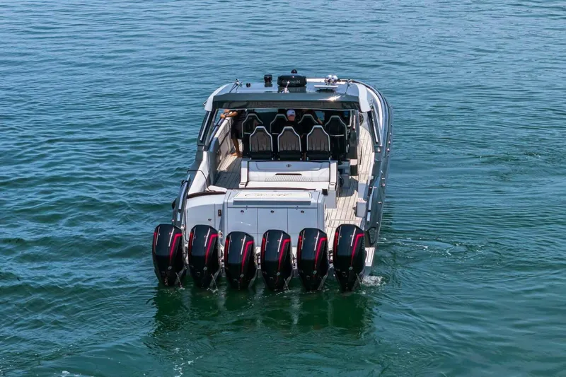  Yacht Photos Pics 2025 Cigarette 52' Thunder boat with six powerful outboard engines on water.