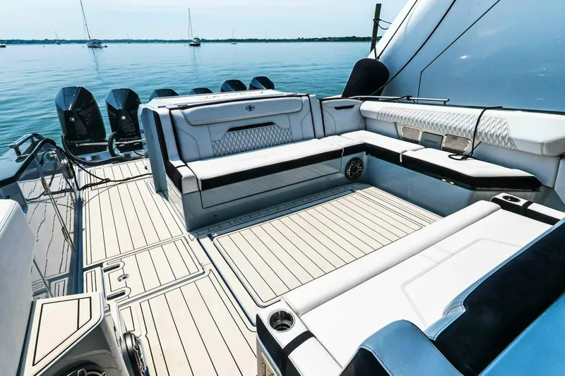  Yacht Photos Pics Luxurious 2025 Cigarette 52' Thunder yacht interior with sleek seating and powerful engines.