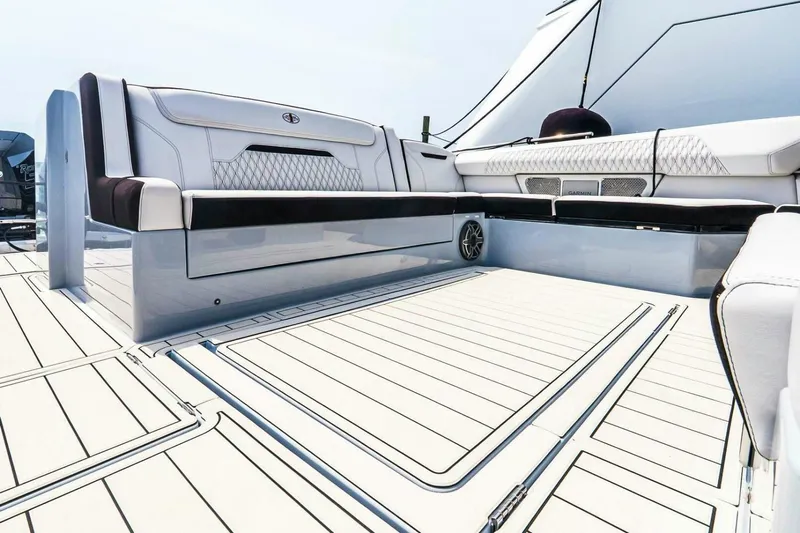  Yacht Photos Pics Luxurious seating on 2025 Cigarette 52' Thunder boat deck, featuring sleek design and premium materials.