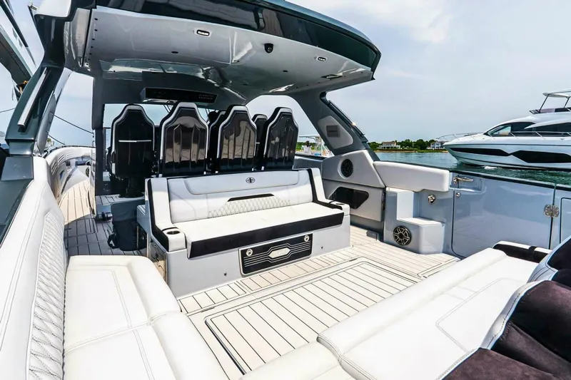  Yacht Photos Pics Luxurious interior of 2025 Cigarette 52' Thunder yacht with sleek seating and modern design.