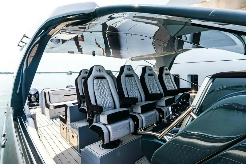  Yacht Photos Pics Luxurious 2025 Cigarette 52' Thunder yacht interior with sleek seating and modern design.