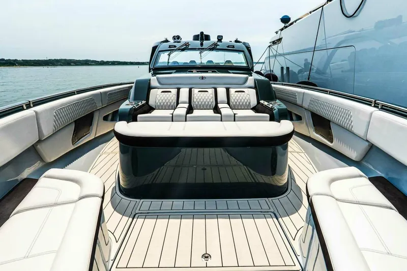  Yacht Photos Pics Luxurious 2025 Cigarette 52' Thunder yacht interior with plush seating and sleek design.