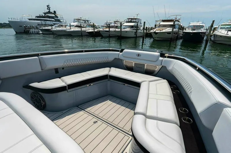  Yacht Photos Pics Luxurious seating area on a 2025 Cigarette 52' Thunder boat docked at a marina.