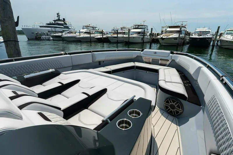  Yacht Photos Pics Luxurious 2025 Cigarette 52' Thunder yacht interior with plush seating and sleek design.