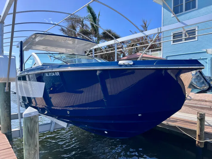 Impulse Yacht Photos Pics 2022 Aviara AV 32 Outboard boat docked, blue hull, sunny day.