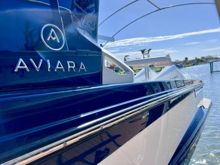 Impulse Yacht Photos Pics 2022 Aviara AV 32 Outboard boat on water, sleek design, sunny day.