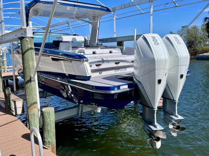 Impulse Yacht Photos Pics Aviara AV 32 Outboard 2022 boat docked with dual engines, sleek design.