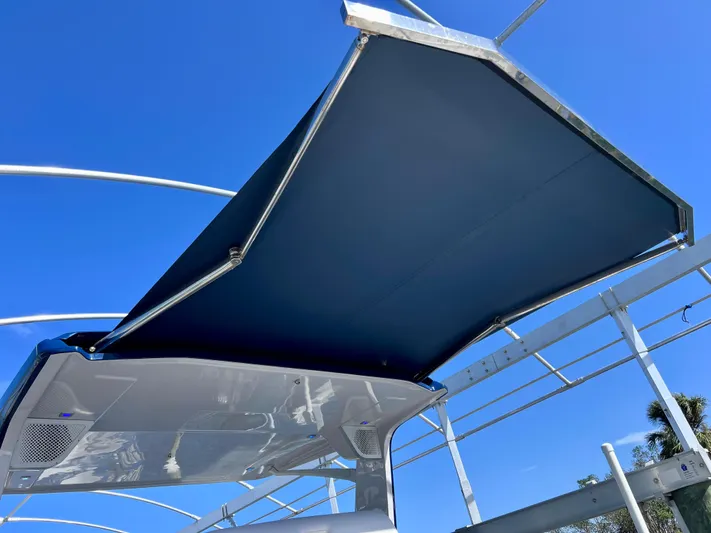 Impulse Yacht Photos Pics 2022 Aviara AV 32 Outboard boat canopy against clear blue sky.