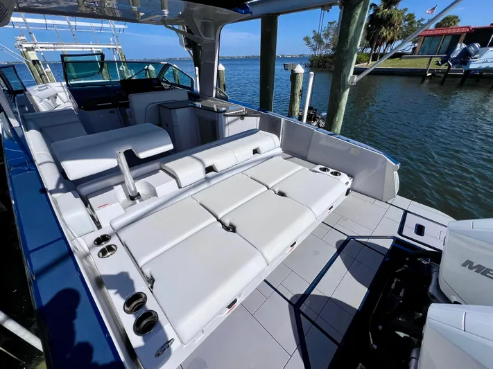 Impulse Yacht Photos Pics 2022 Aviara AV 32 Outboard boat with spacious seating and modern design by the water.