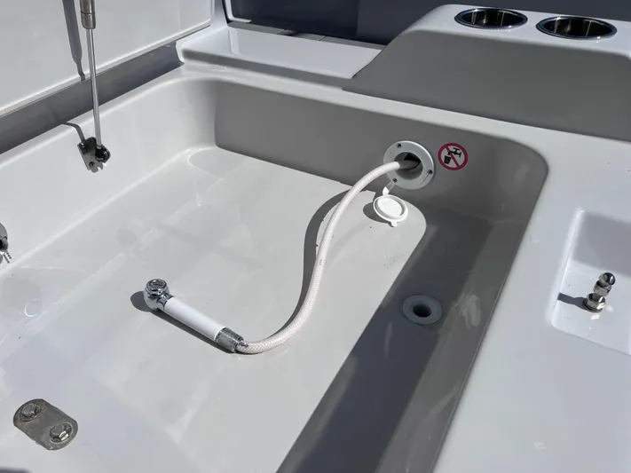Impulse Yacht Photos Pics Aviara AV 32 Outboard 2022 boat deck with hose and cup holders.