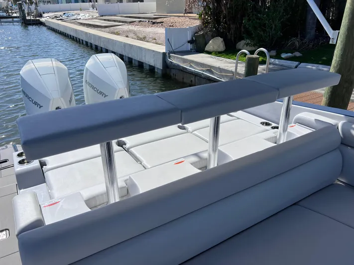 Impulse Yacht Photos Pics 2022 Aviara AV 32 Outboard boat with dual Mercury engines, docked by a canal.