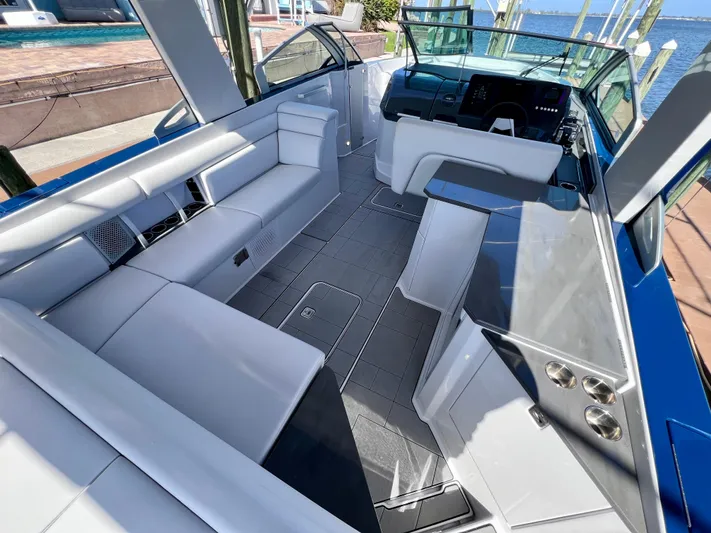 Impulse Yacht Photos Pics 2022 Aviara AV 32 Outboard boat interior with sleek seating and modern dashboard.