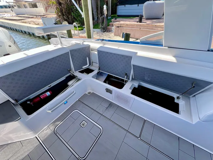 Impulse Yacht Photos Pics 2022 Aviara AV 32 Outboard boat with open storage compartments and sleek deck design.