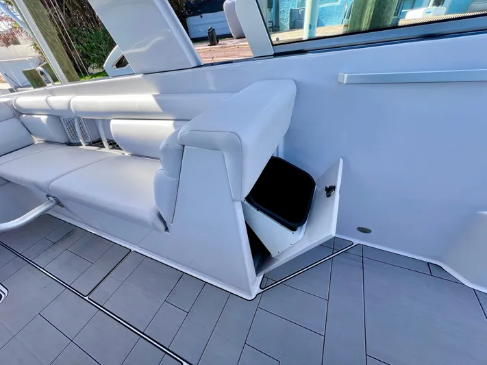 Impulse Yacht Photos Pics 2022 Aviara AV 32 Outboard interior with white seating and storage compartment.