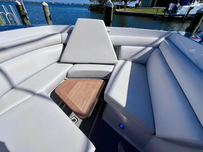Impulse Yacht Photos Pics 2022 Aviara AV 32 Outboard boat interior with luxurious seating and wooden accents.