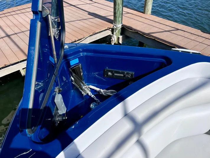 Impulse Yacht Photos Pics 2022 Aviara AV 32 Outboard boat with open storage compartment by the dock.