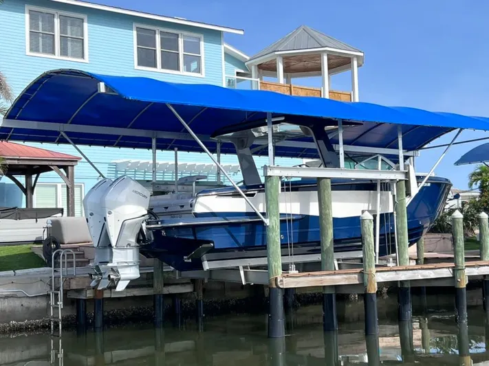 Impulse Yacht Photos Pics 2022 Aviara AV 32 Outboard with Joystick docked under blue canopy.