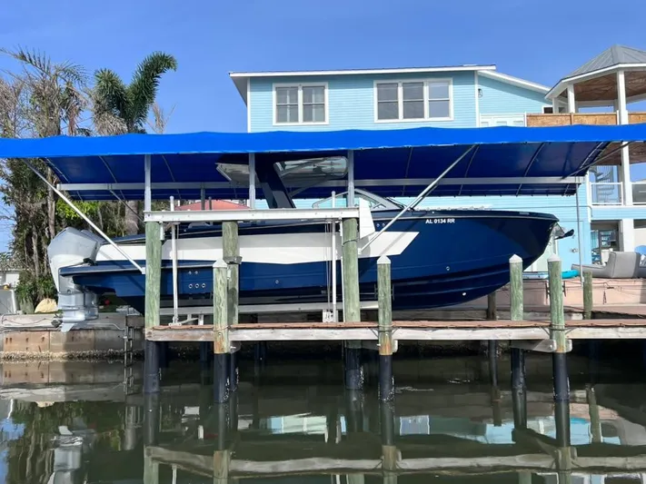 Impulse Yacht Photos Pics 2022 Aviara AV 32 Outboard with Joystick docked under blue canopy.