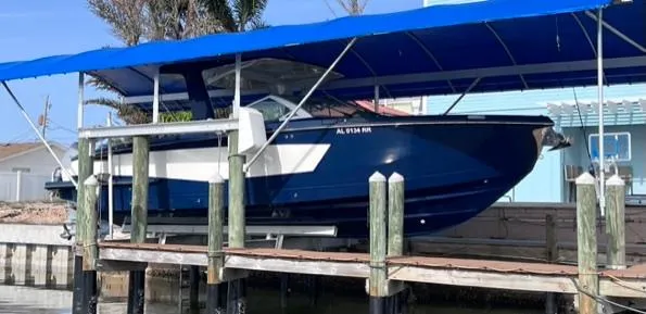 Impulse Yacht Photos Pics 2022 Aviara AV 32 Outboard with Joystick, docked under blue canopy.