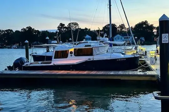 Sea Glass II Yacht Photos Pics 2024 Ranger Tugs R-27 Luxury Edition docked at sunset, reflecting on calm water.