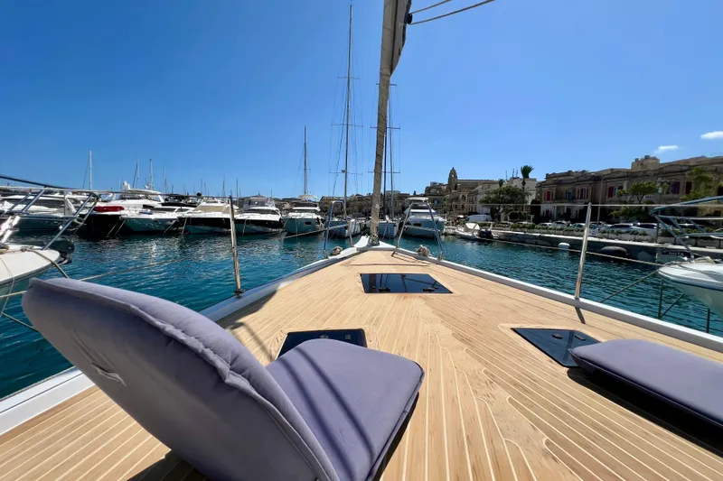 Gr Yacht Photos Pics Luxurious 2017 Grand Soleil 52LC yacht docked in a scenic marina under clear blue skies.