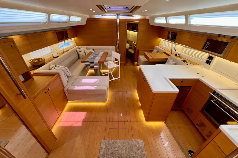 Gr Yacht Photos Pics Luxurious interior of 2017 Grand Soleil 52LC yacht with modern kitchen and seating area.