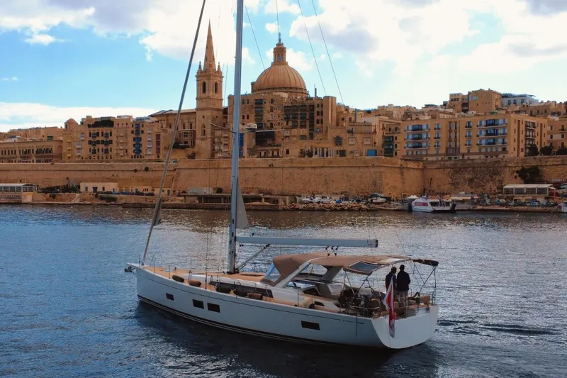 Gr Yacht Photos Pics Sailing yacht Grand Soleil 52LC 2017 cruising near historic waterfront buildings.