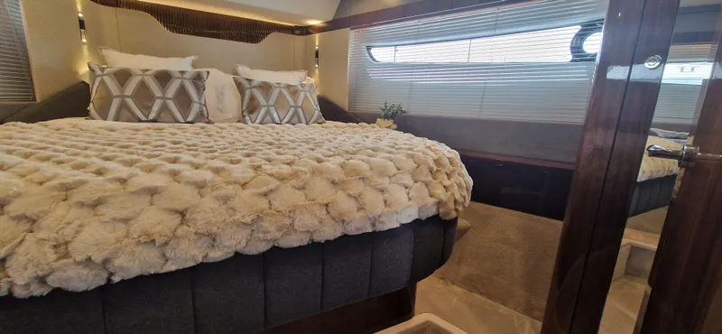  Yacht Photos Pics Luxurious bedroom in Fairline Targa 40 yacht, 2024 model.