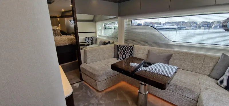  Yacht Photos Pics Interior of Fairline Targa 40 yacht, 2024 model, featuring luxurious sofa and table.