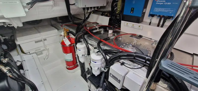  Yacht Photos Pics Engine room of 2024 Fairline Targa 40 with fire extinguisher and wiring.