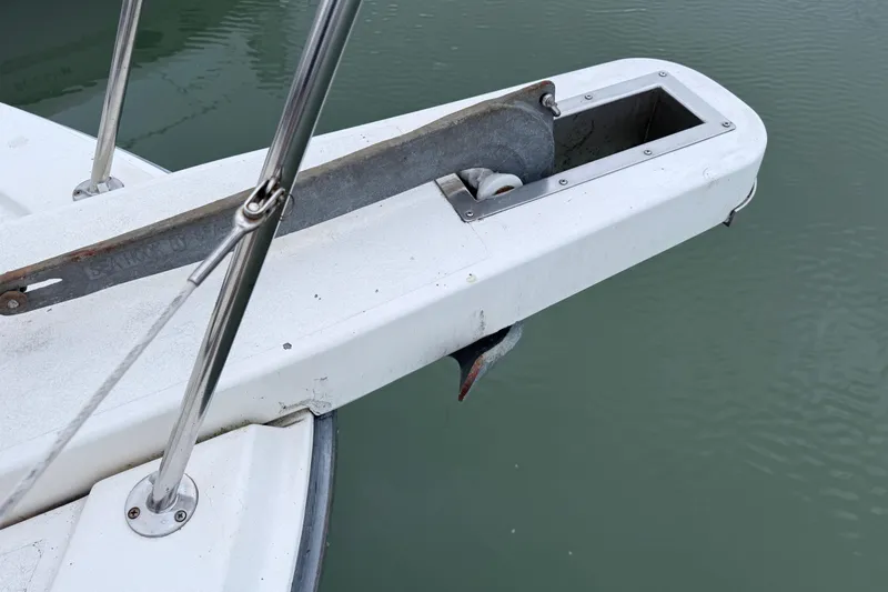 Qui-si-sana Yacht Photos Pics Bow of 1989 Jefferson 52 Victory yacht with anchor mechanism over water.