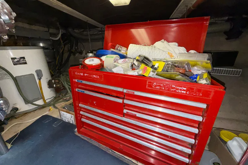 Qui-si-sana Yacht Photos Pics Red tool chest filled with various tools and supplies in a Jefferson 52 Victory, 1989 model.