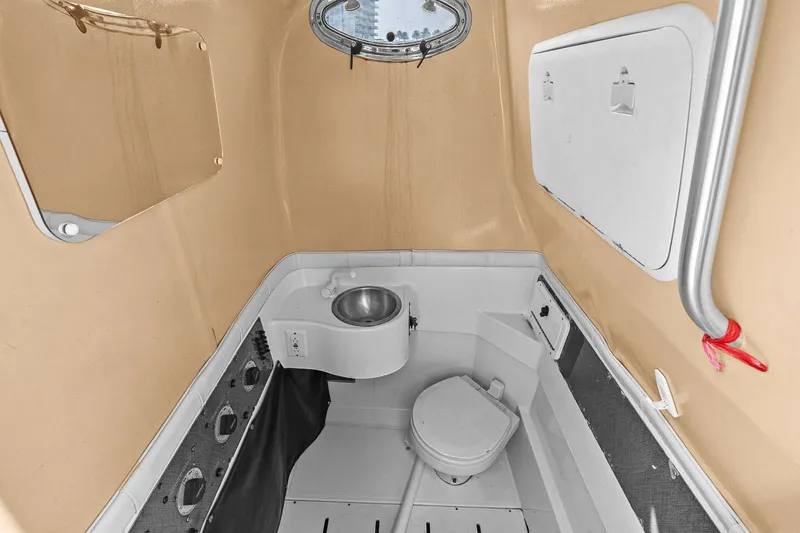  Yacht Photos Pics Interior of 2004 Hydra-Sports Vector 3300 CC with toilet and sink.