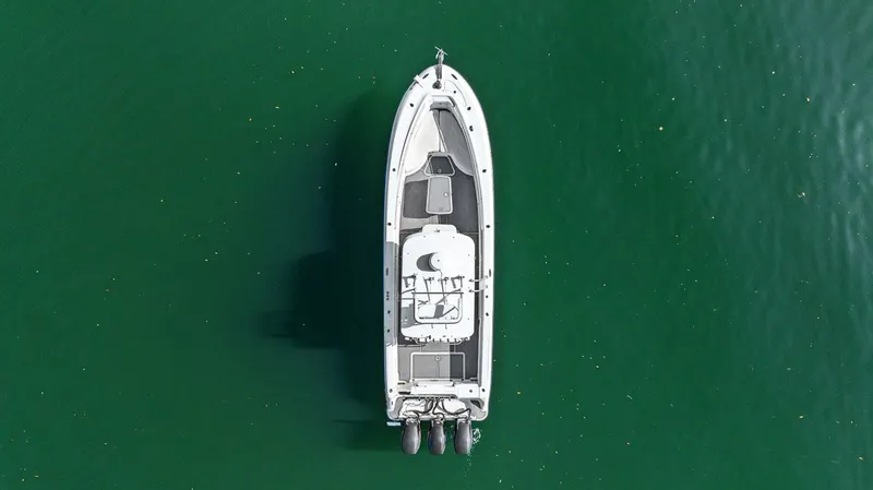  Yacht Photos Pics Aerial view of 2004 Hydra-Sports Vector 3300 CC on green water.